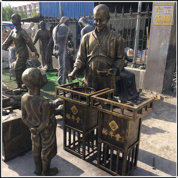 現(xiàn)代步行街飯店門口人物銅雕塑